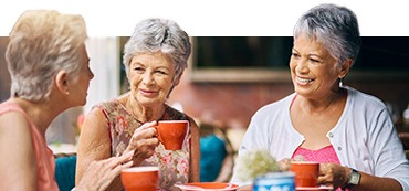 Cropped shot of a group of senior female friends enjoying a lunch date