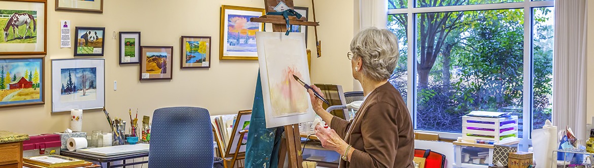 Woman painting in art studio