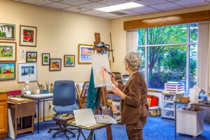 Woman painting in art studio